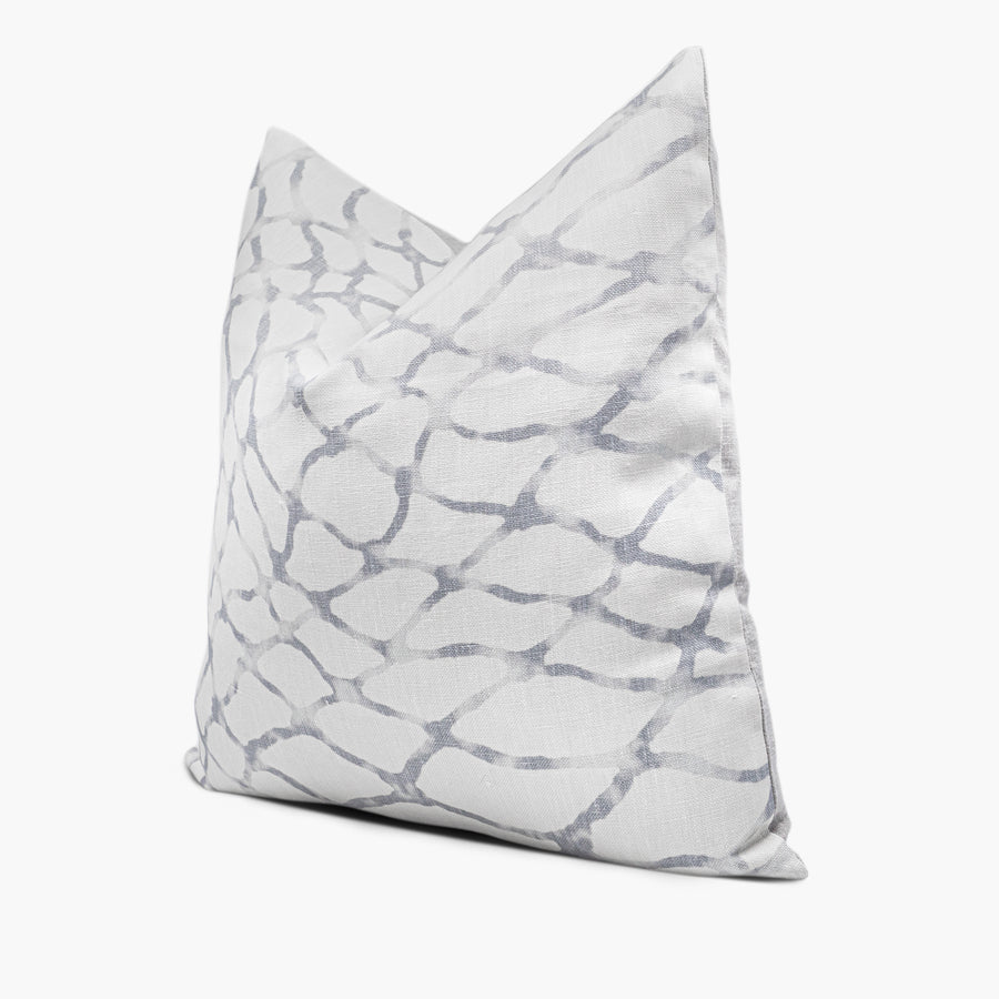 Side view of abstract throw pillow cushion with Waterpolo fabric in blue-gray and white