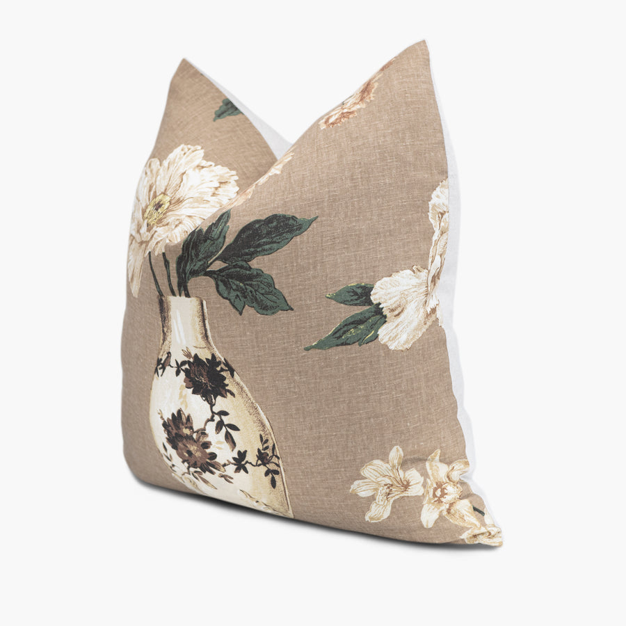 Side view of floral throw pillow with an Asian flower and vase motif in brown and green