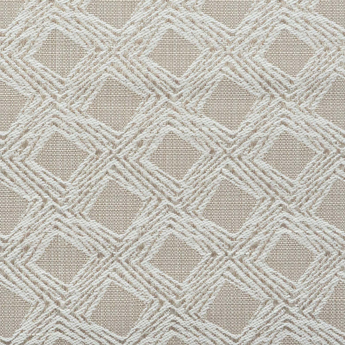 A close-up of fabric with a beige, geometric diamond motif.