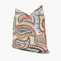 Side view of boho paisley throw pillow in red, orange, and blue