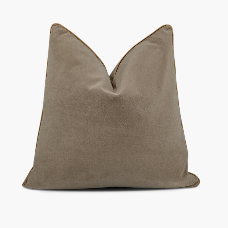 Brown velvet throw pillow with gold piping