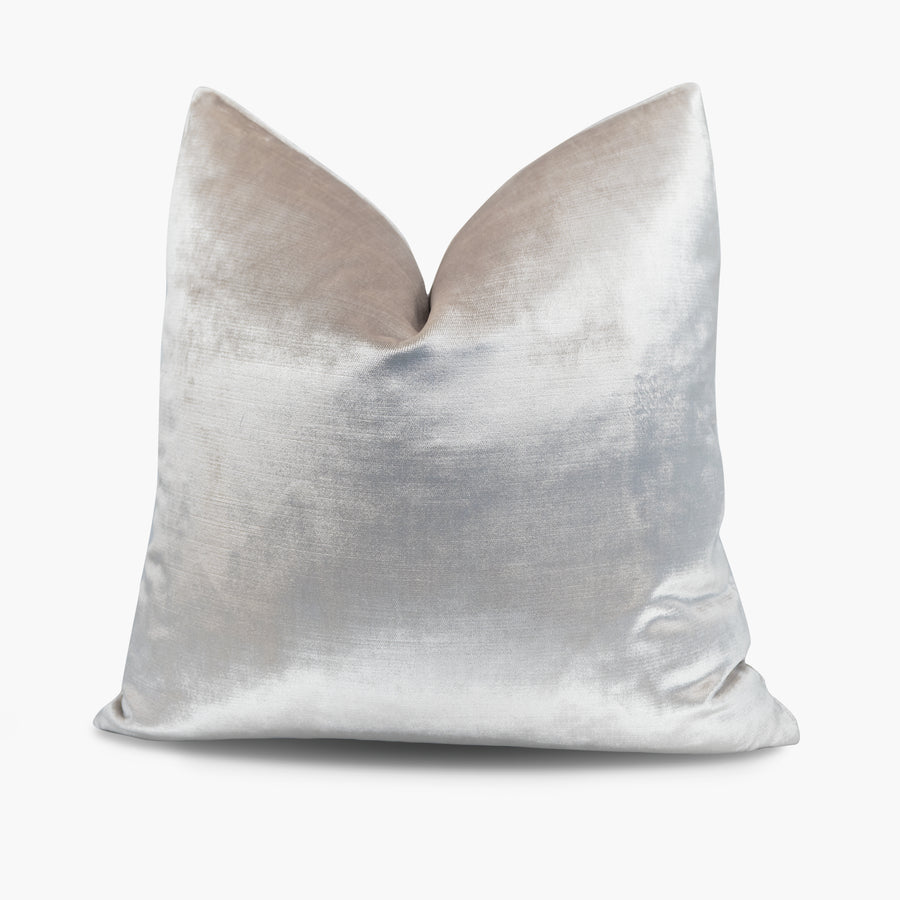 Velvet throw pillow in an iridescent champagne-ivory tone