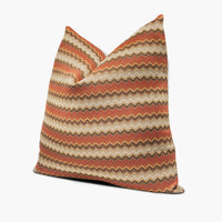 Side view of chevron throw pillow cushion in brick red and earth brown