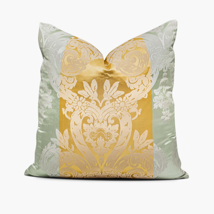 A silk-blend throw pillow sits against a white background. The pillow features a damask motif set against three vertical stripes. The middle stripe is gold and the outer stripes are pale green.