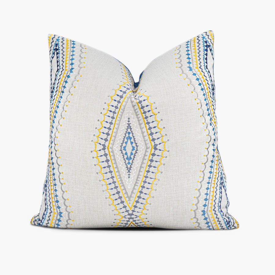 Embroidered throw pillow with diamond medallion motif in blue, gold, and silver