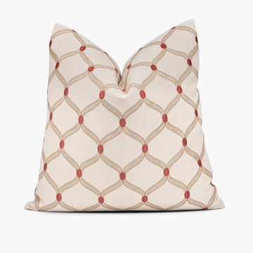 Embroidered throw pillow cushion with a red dot ogee pattern