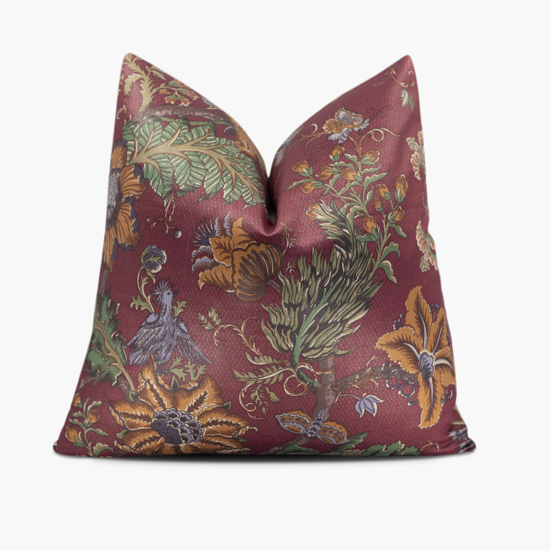 Burgundy red throw pillow with a floral and exotic bird motif