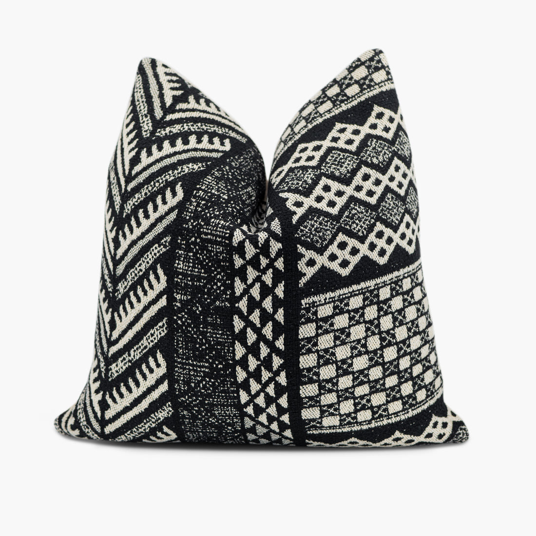 Black and white throw pillow with a geometric tribal pattern