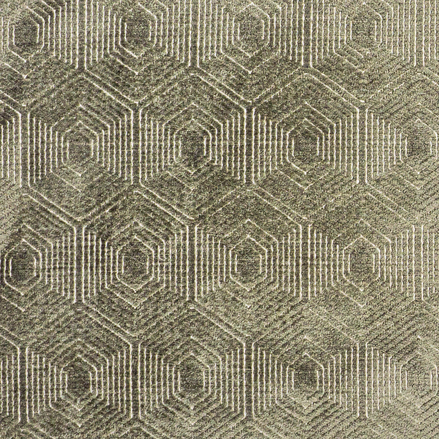 Macro shot of moss green velvet fabric with a geometric hexa-diamond motif