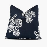 Indigo blue throw pillow cushion with white hibiscus floral motif