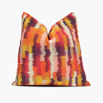 Ikat flame stitch throw pillow in red, orange, yellow, and purple