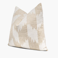 Side view of khaki and white throw pillow cushion with a bohemian ikat pattern