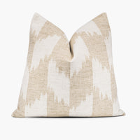 Khaki and white throw pillow cushion with a bohemian ikat pattern