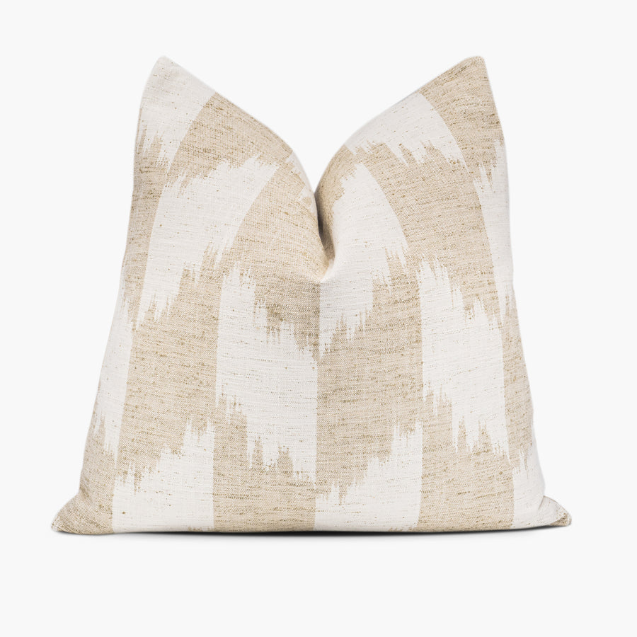 Khaki and white throw pillow cushion with a bohemian ikat pattern