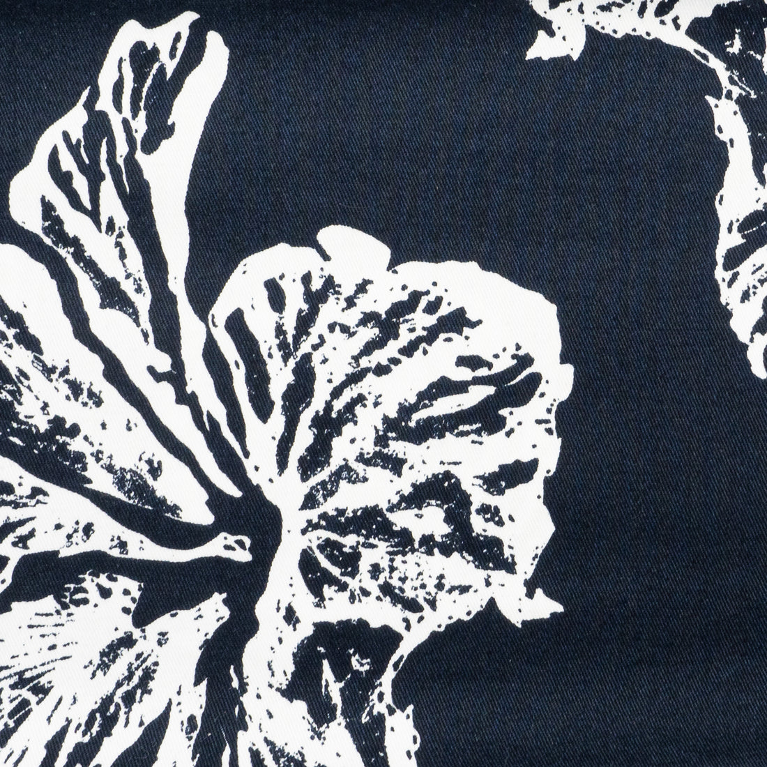 Indigo blue fabric with large white hibiscus flowers