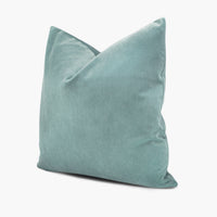 Side view of jade green velvet throw pillow