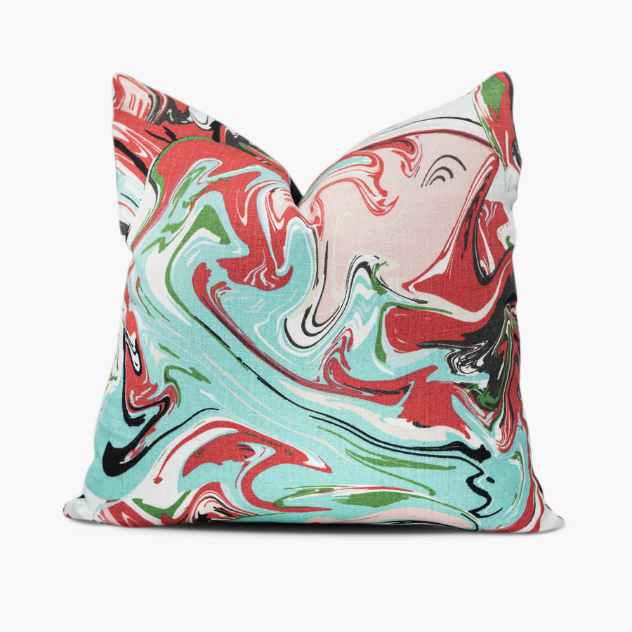 Kate Spade fabric throw pillow with marble swirl motif in red, pink, and aqua blue