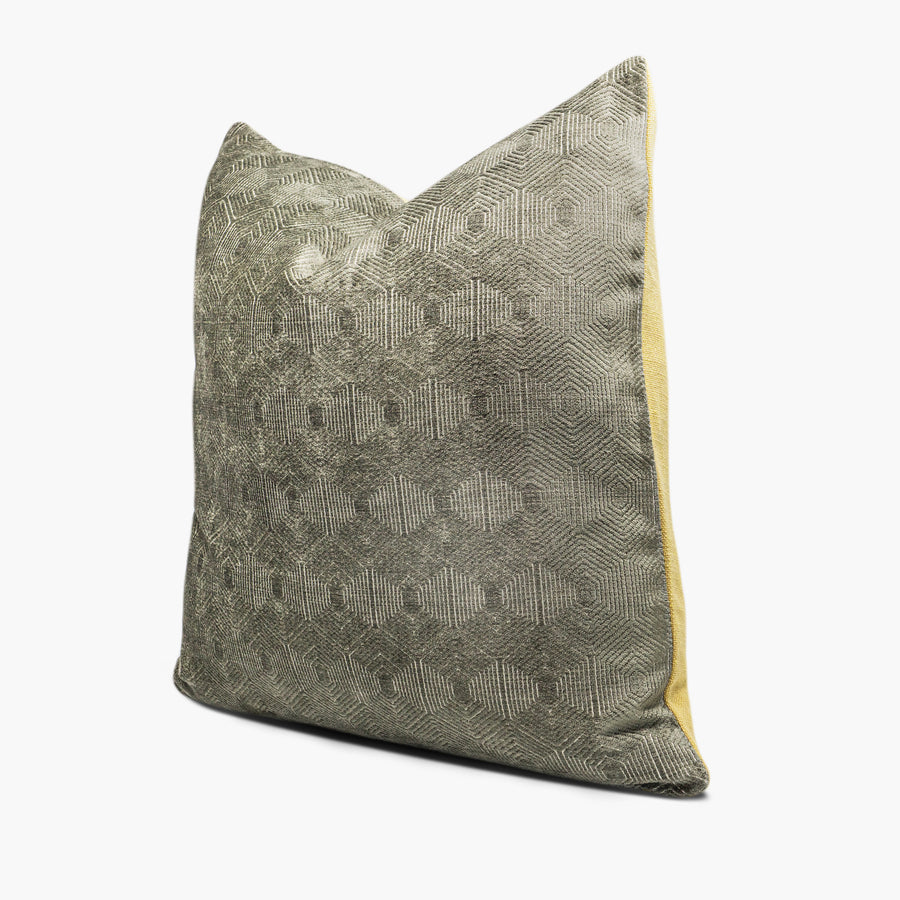 Side view of moss green velvet throw pillow with a geometric hexa-diamond motif