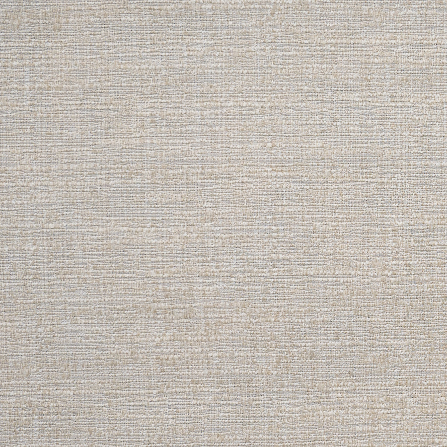 A close-up of a pale gold fabric with a woven texture