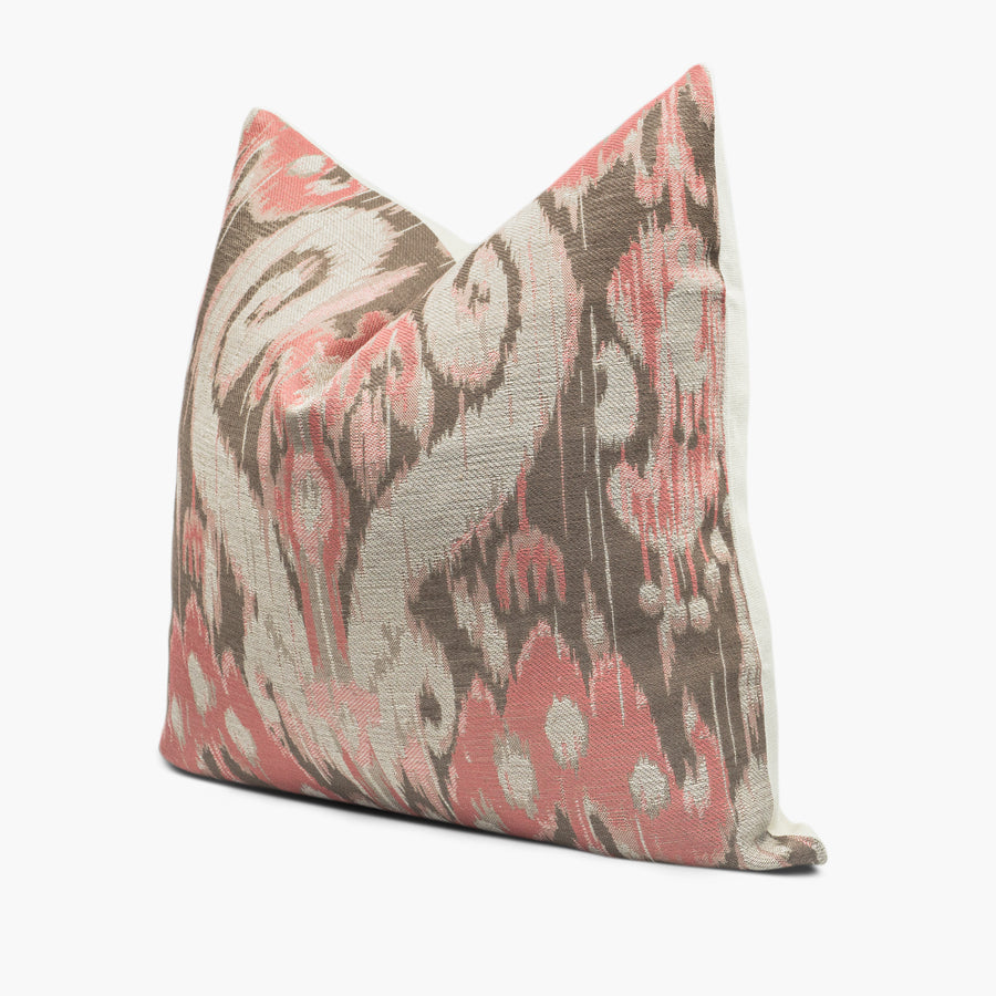 Side view of pink and silver ikat throw pillow cushion