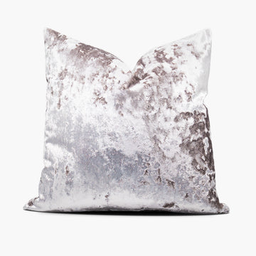 A pale purple, crushed velvet decorative throw pillow