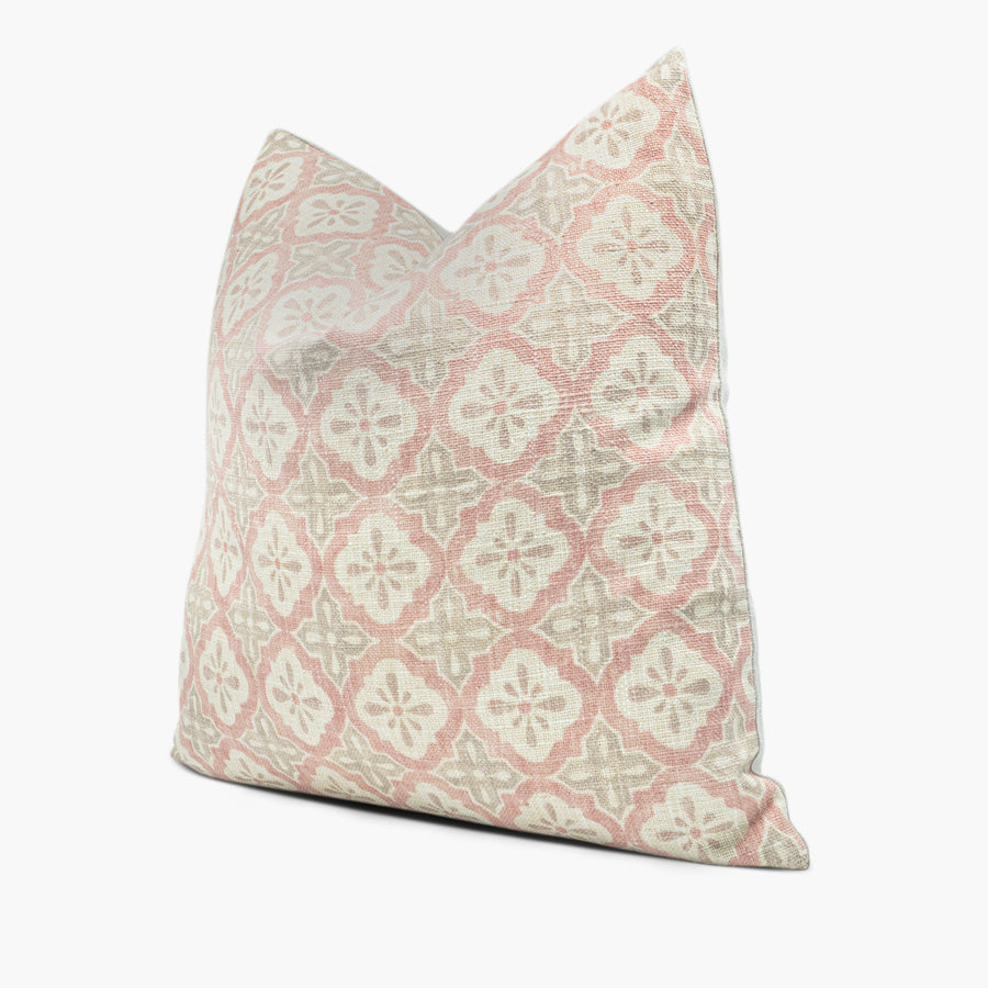 Side view of quatrefoil geometric throw pillow cushion in dusty pink and taupe