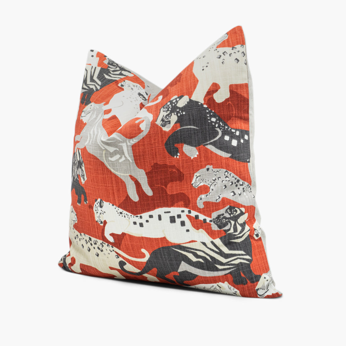 Side view of red tiger print throw pillow with black and white tigers