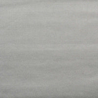 A close-up of a solid dark gray fabric.