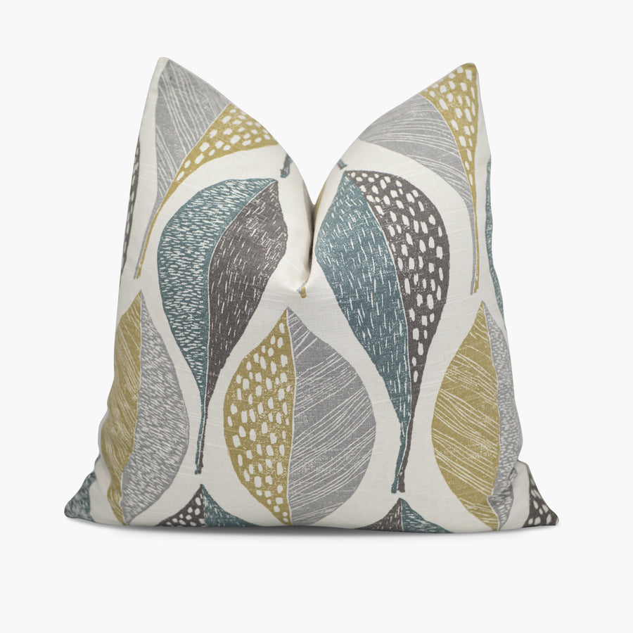 Teal green and gray throw pillow with a large leaf pattern