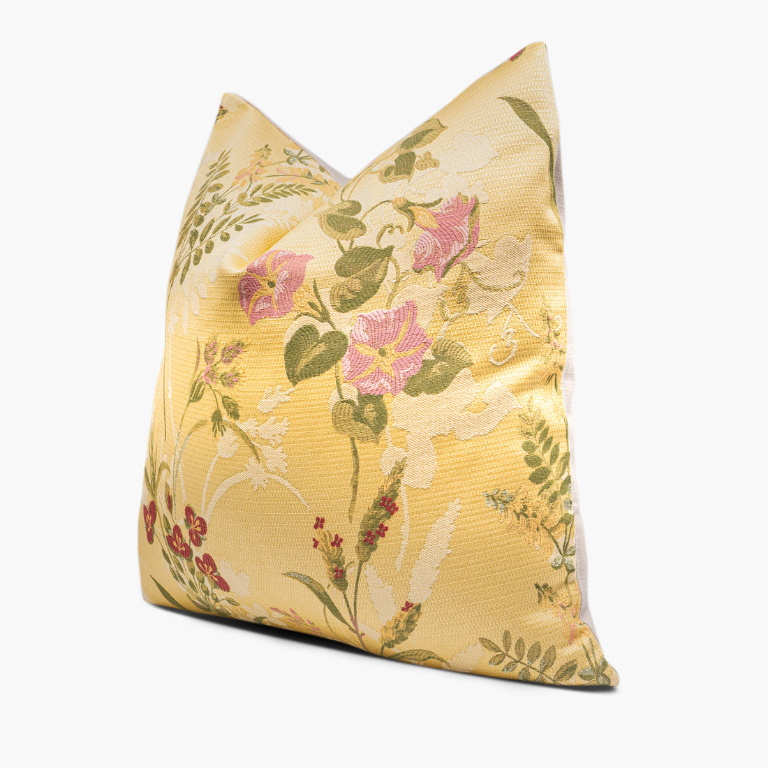 Side view of yellow floral throw pillow with pink morning glories